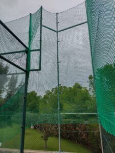 Tennis court perimeter enclosure systems